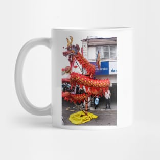 A cruled long red dragon on a Chinese New Year festival on a street in Georgetown. Mug